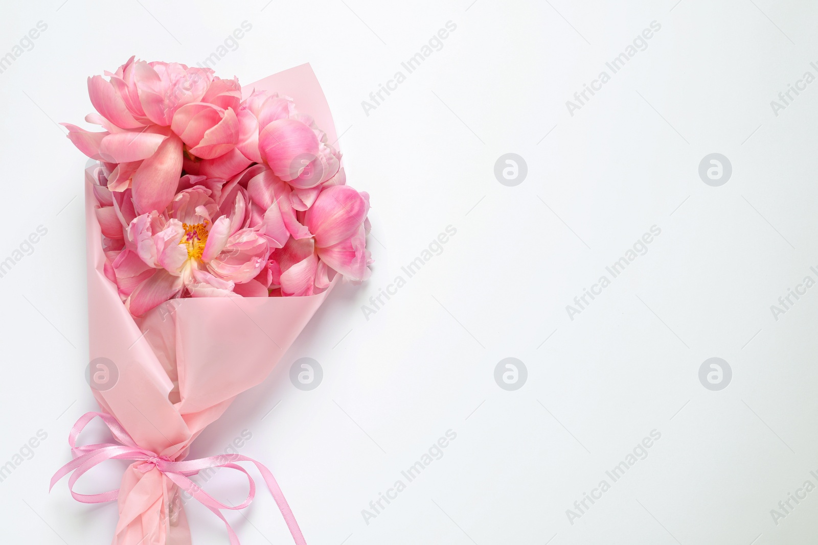 Photo of Beautiful bouquet of pink peonies on white background, top view