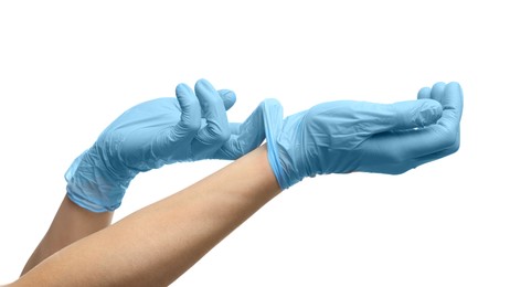 Doctor wearing light blue medical gloves on white background, closeup