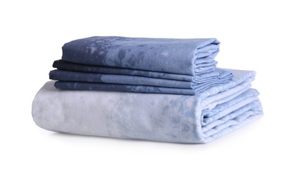 Photo of Stack of clean bed linen isolated on white