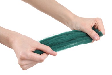 Woman holding teal felting wool on white background, closeup