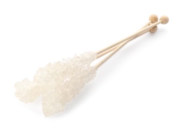 Wooden sticks with sugar crystals isolated on white. Tasty rock candies