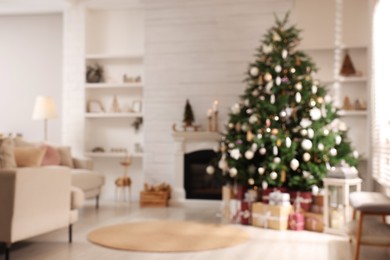 Festive living room interior with beautiful Christmas tree, blurred view