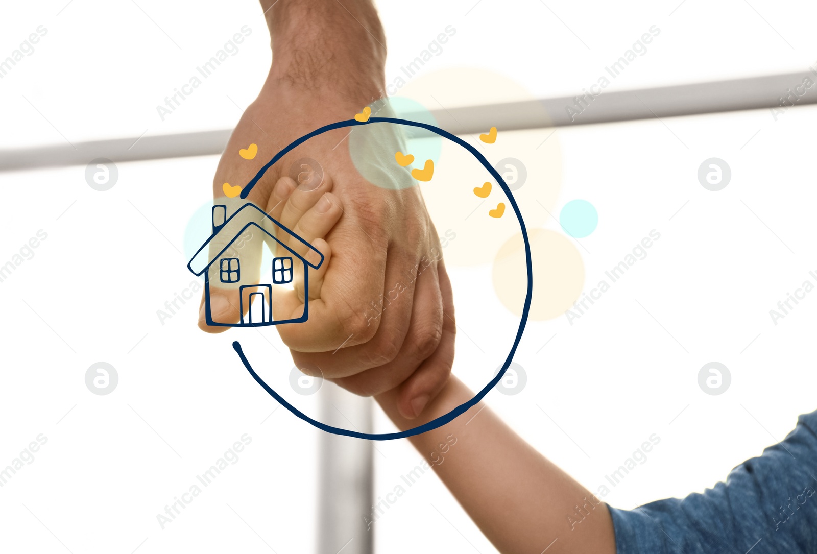 Image of Father holding hands with child and illustration of house indoors, closeup. Adoption concept