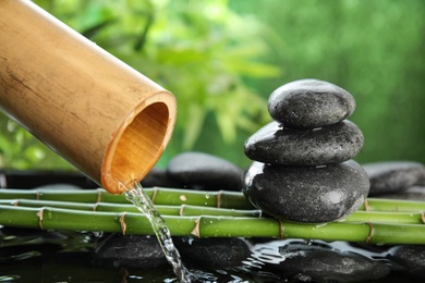 Photo of Traditional bamboo fountain with zen stones