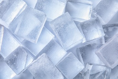 Photo of Many clear ice cubes as background, top view
