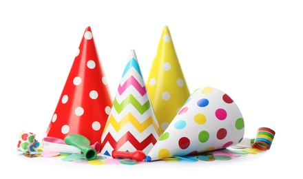 Colorful party hats and other festive items on white background