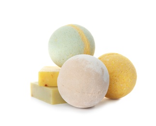 Bath bombs and soap bars on white background