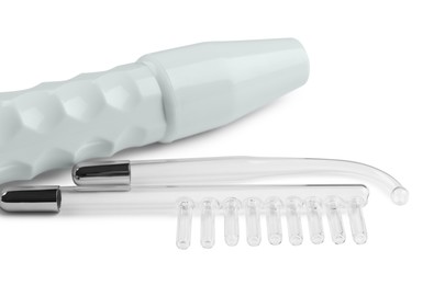 Photo of Modern darsonval with nozzles on white background. Microcurrent therapy