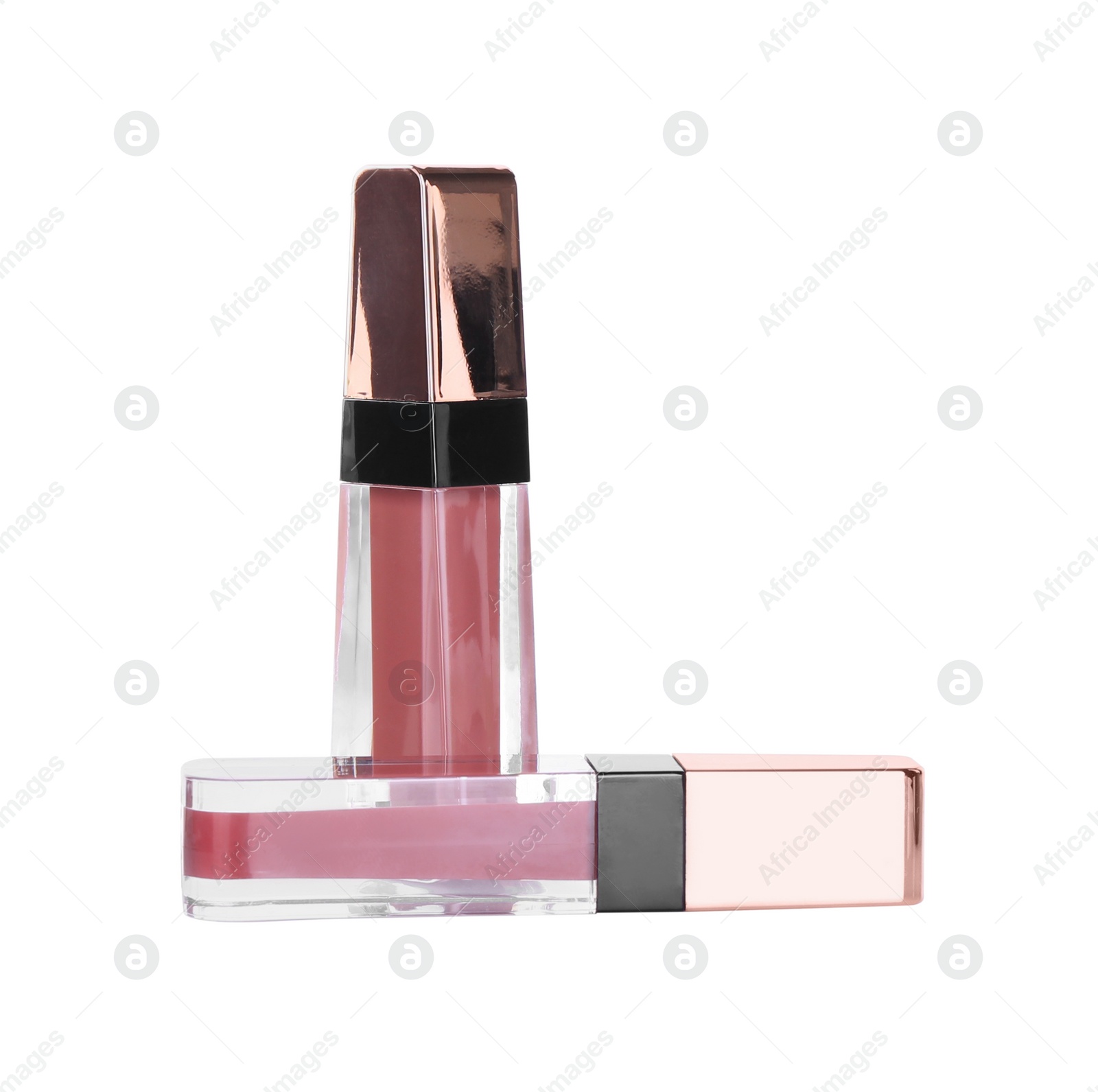 Photo of Two lip glosses isolated on white. Cosmetic products