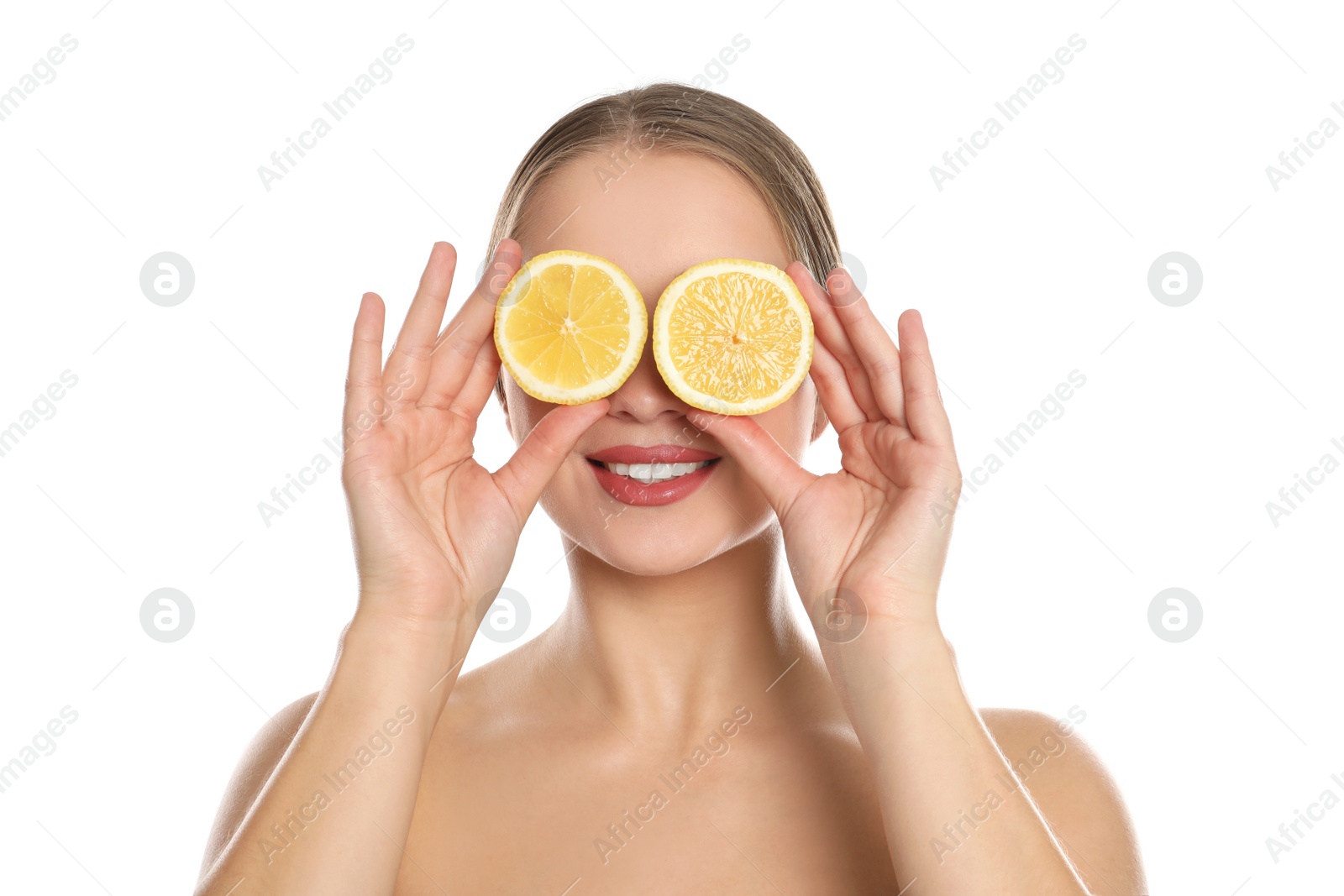 Photo of Young woman with cut lemon on white background. Vitamin rich food