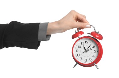 Photo of Businesswoman holding alarm clock on white background, closeup. Time management