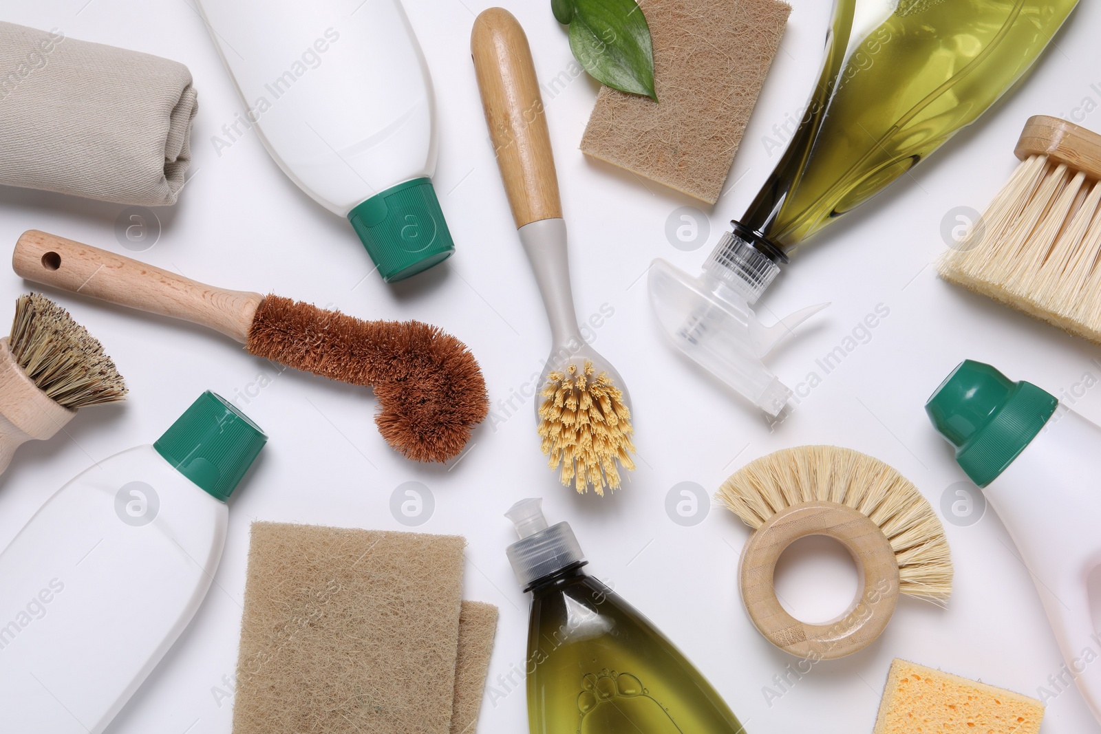 Photo of Flat lay composition with different cleaning supplies on white background