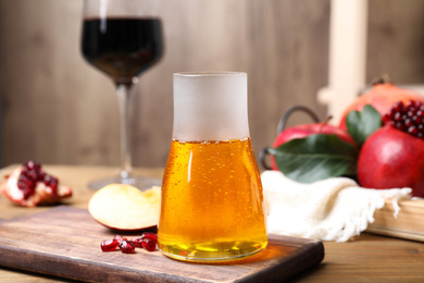 Jar with honey on wooden table. Rosh Hashanah holiday