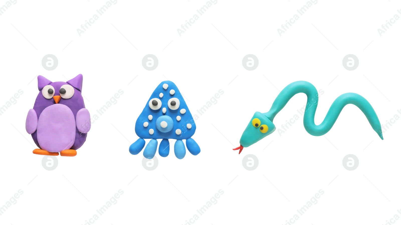 Photo of Colorful plasticine, owl, snake and octopus on white background, top view