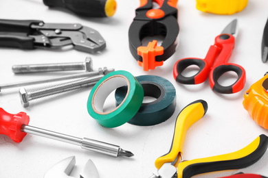 Different construction tools on white background, closeup