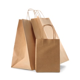 Mockup of paper shopping bags on white background