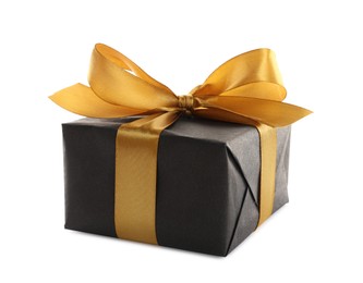 Beautiful gift box with golden ribbon and bow on white background