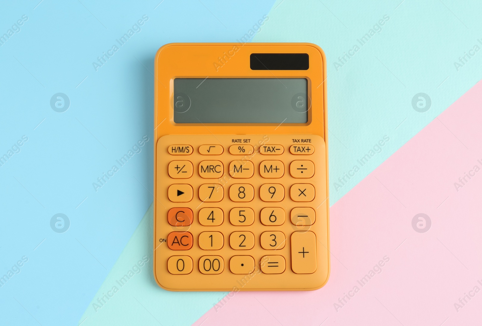 Photo of Modern calculator on color background, top view