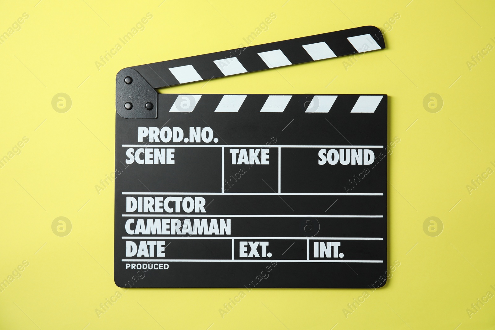 Photo of Clapperboard on color background, top view. Cinema production