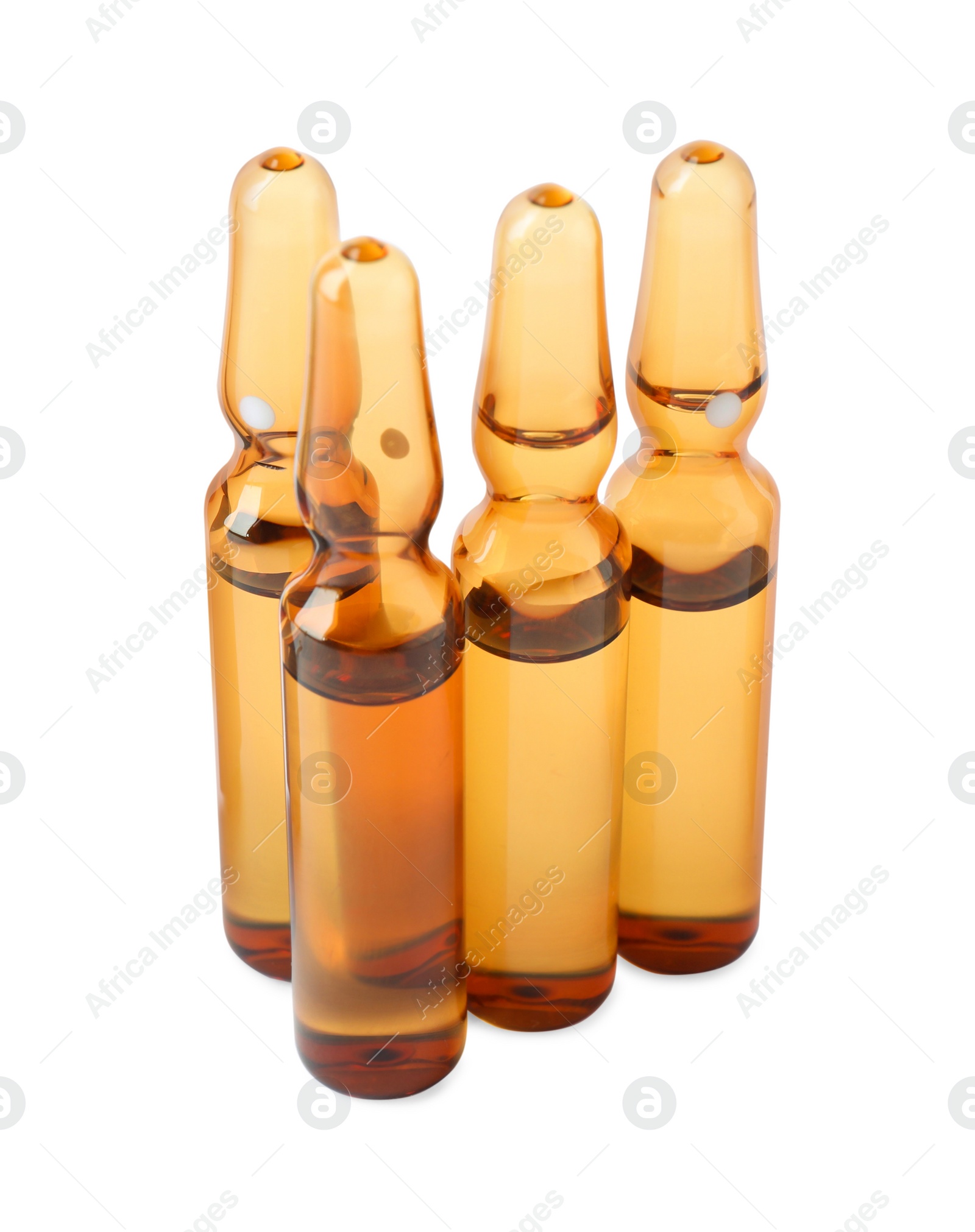 Photo of Brown pharmaceutical ampoules with medication on white background