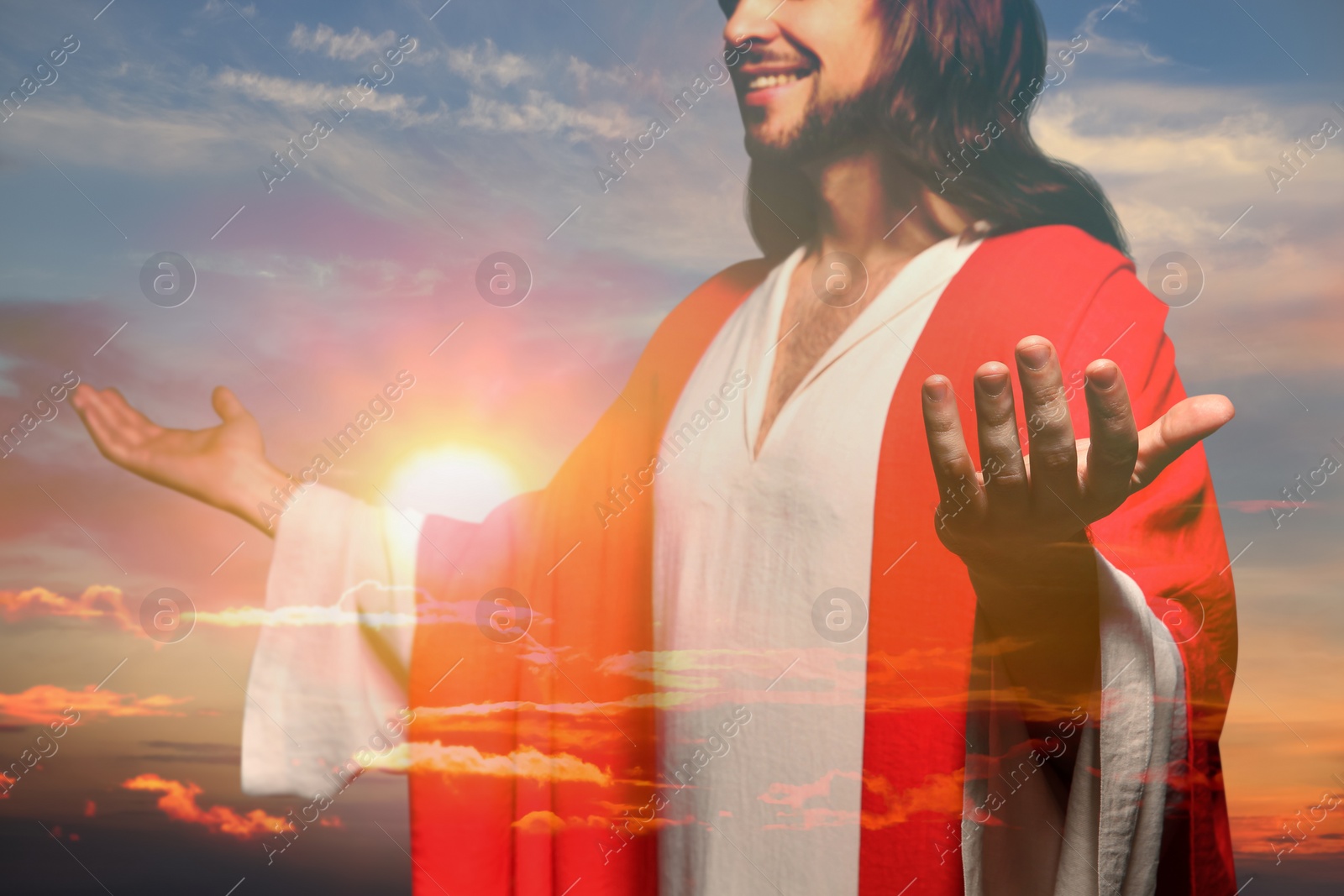 Image of Jesus Christ reaching out his hands and praying at sunset, double exposure
