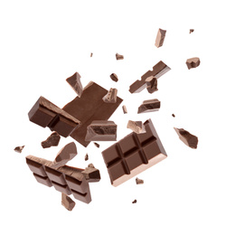 Milk chocolate pieces falling on white background