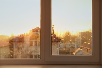 Photo of White window sill on rainy day in morning