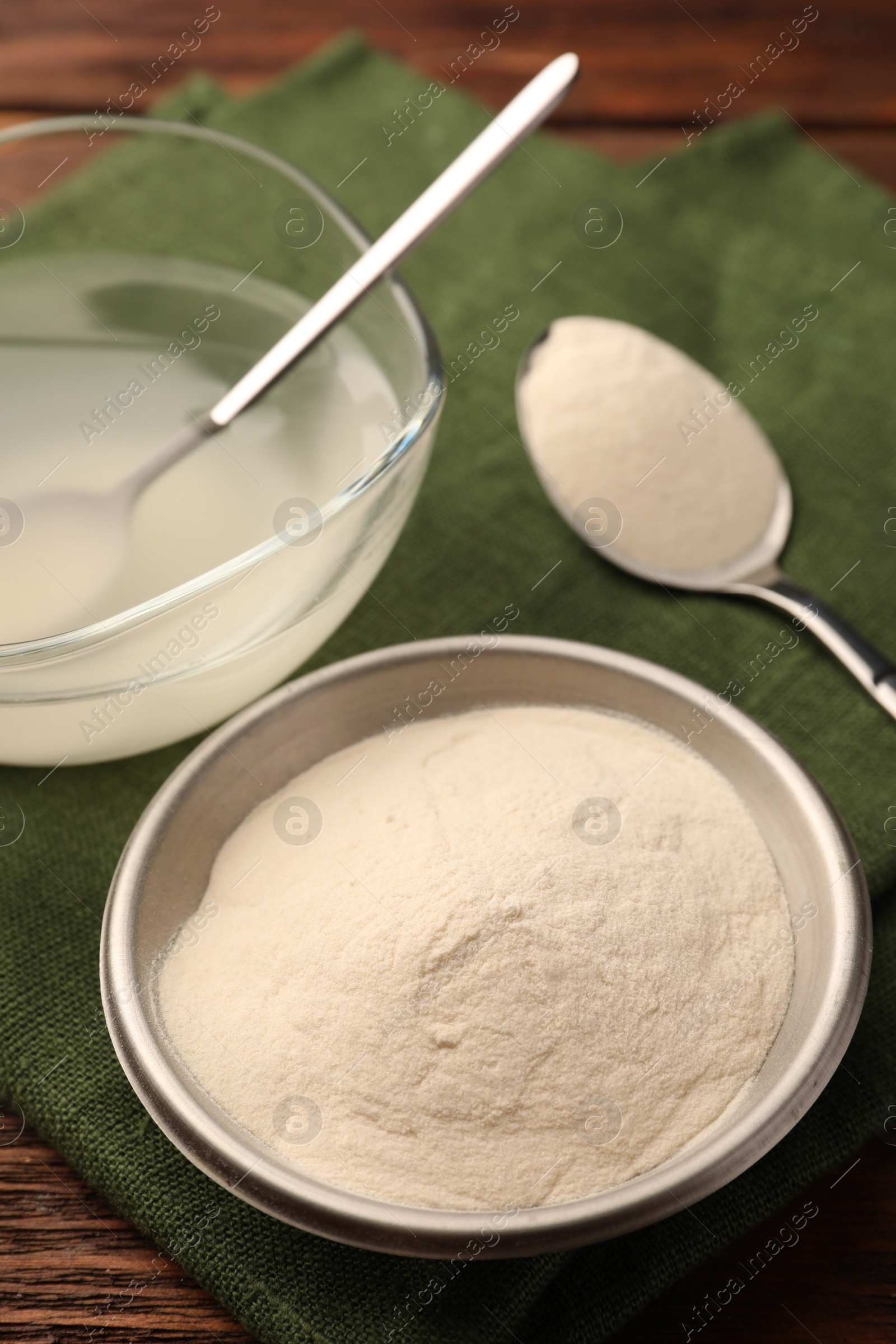 Photo of Agar-agar jelly and powder on wooden table