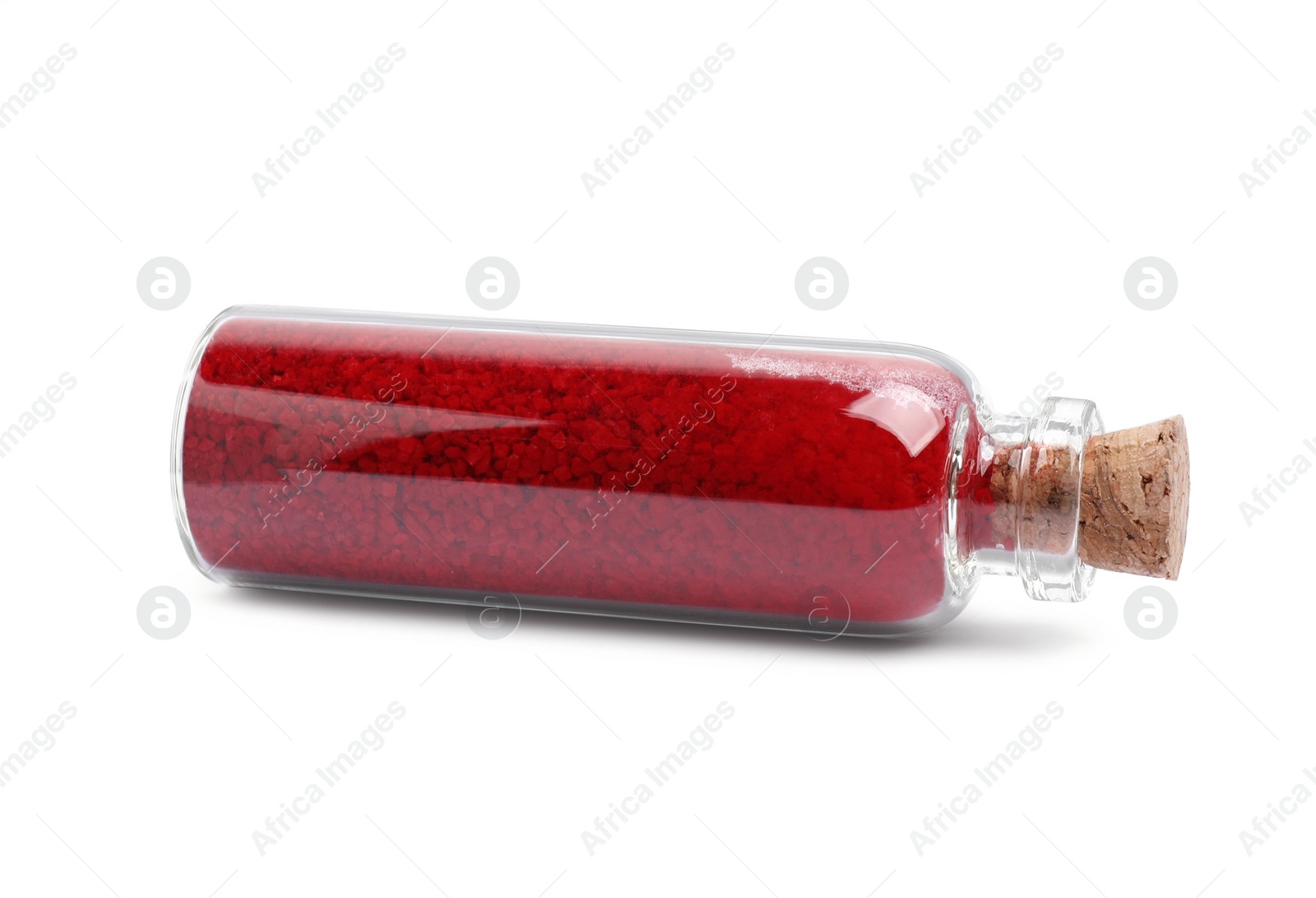 Photo of Glass bottle of red food coloring isolated on white