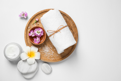 Composition with spa stones on white background, top view