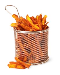 Photo of Delicious sweet potato fries in frying basket on white background