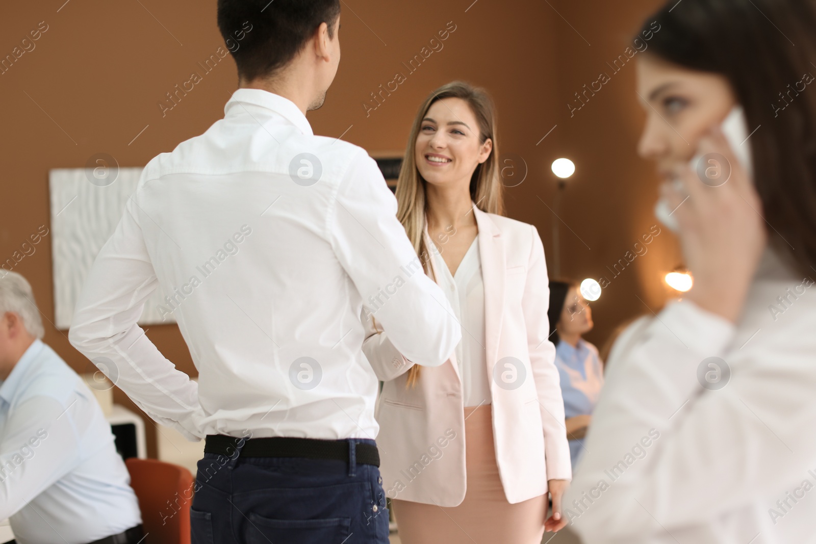 Photo of Human resources manager shaking hands with applicant during job interview in office