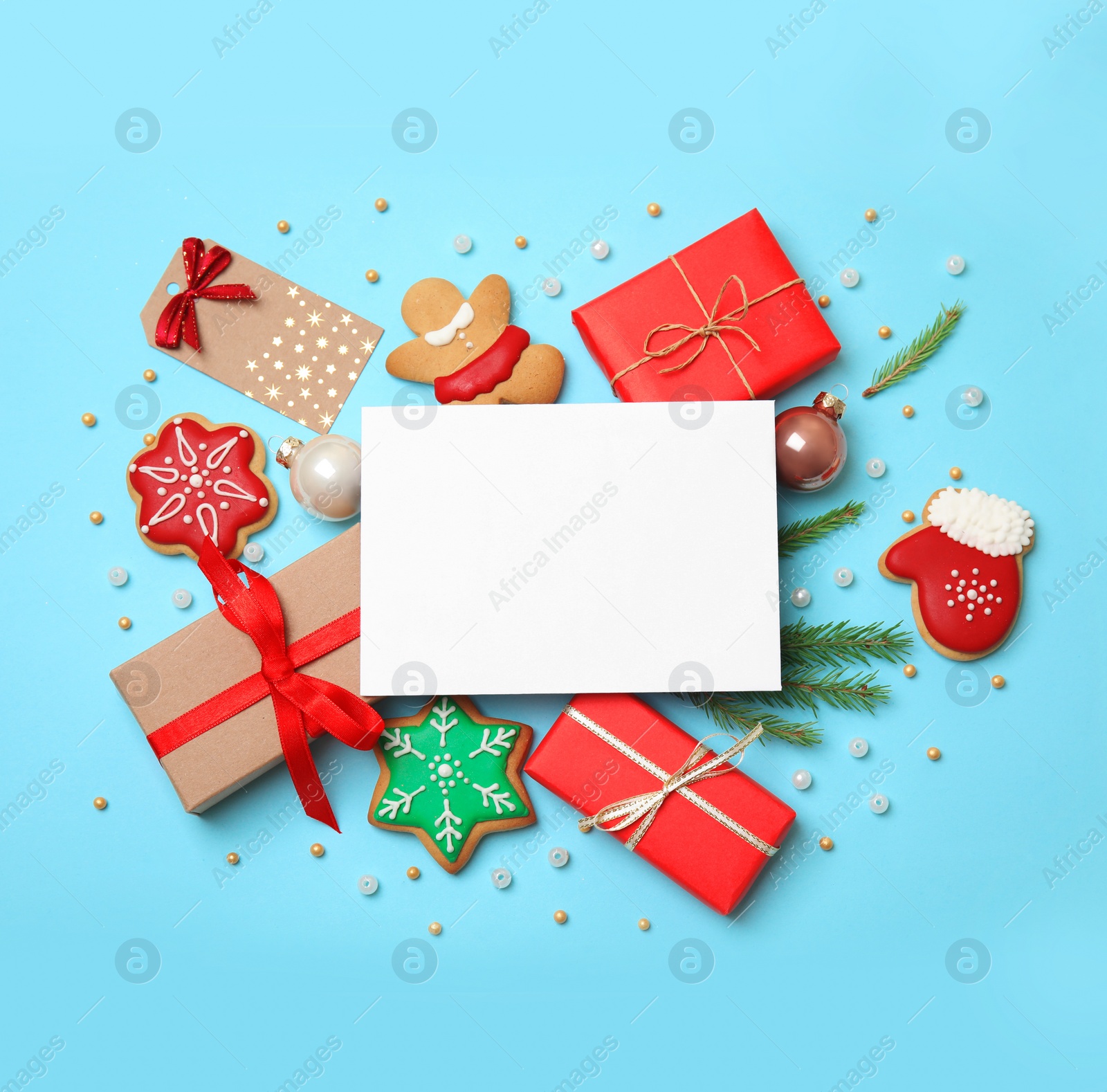 Photo of Flat lay composition with Christmas decor on blue background