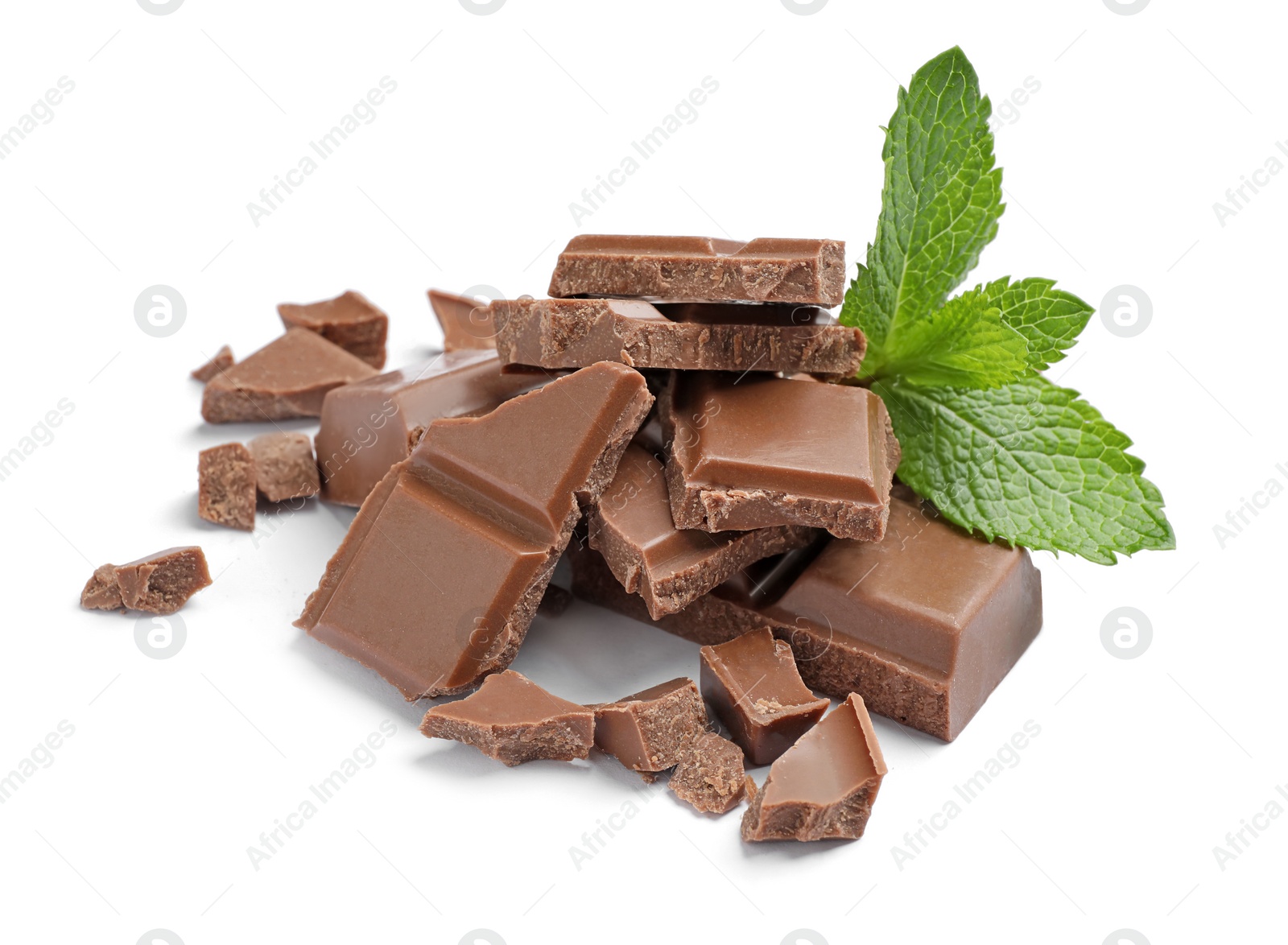 Photo of Pieces of milk chocolate with mint on white background