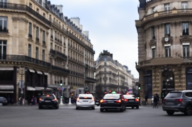 Blurred view of street with beautiful buildings and cars