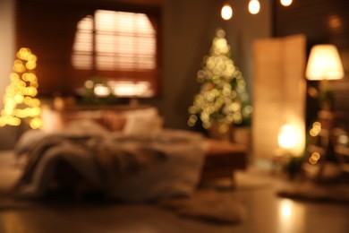 Blurred view of bedroom interior with Christmas decor