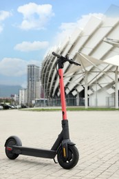 Modern electric scooter outdoors on sunny day. Rental service