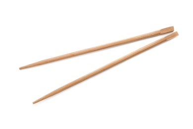 Photo of Chopsticks made of bamboo on white background