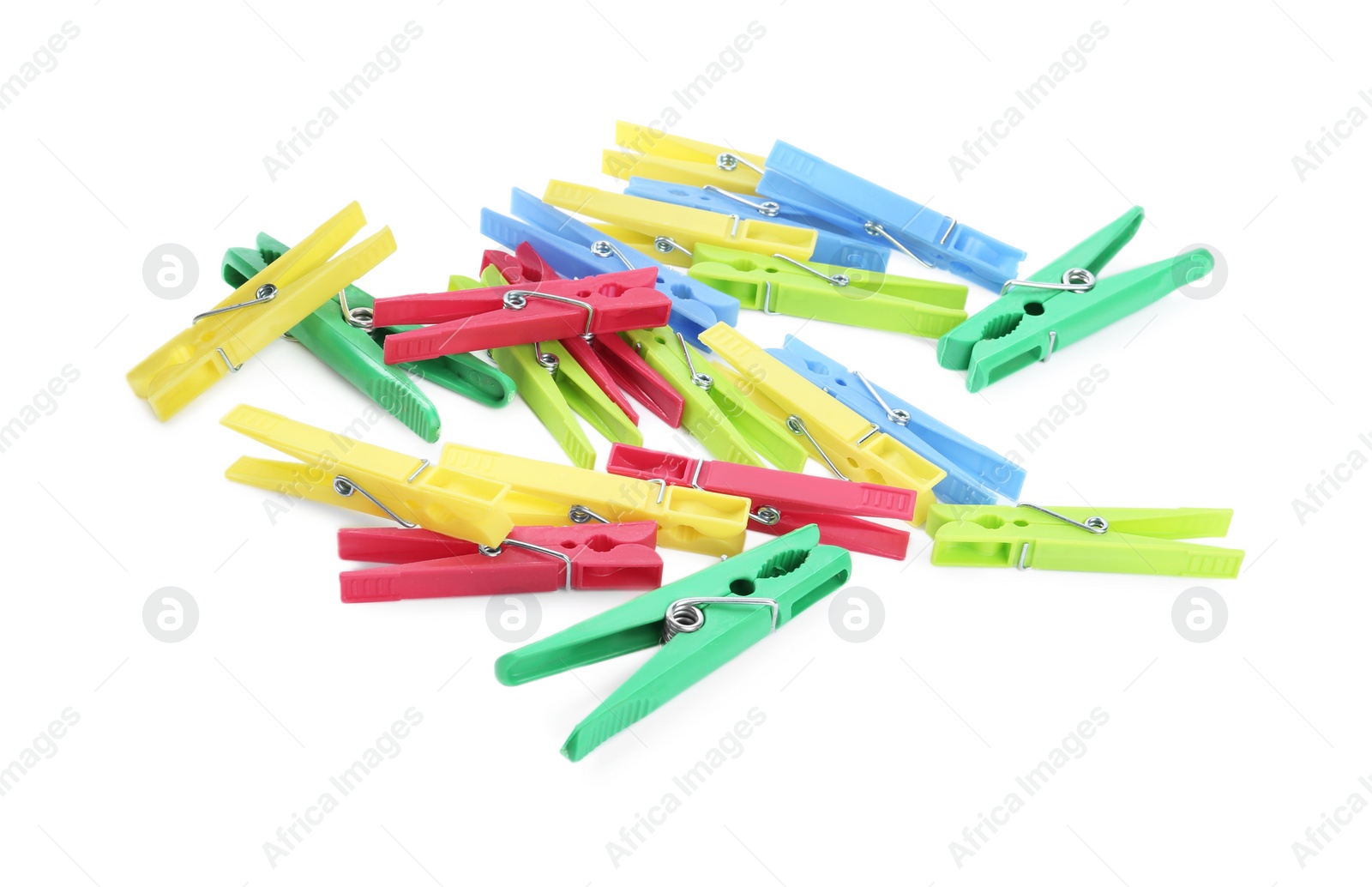 Photo of Many colorful plastic clothespins on white background