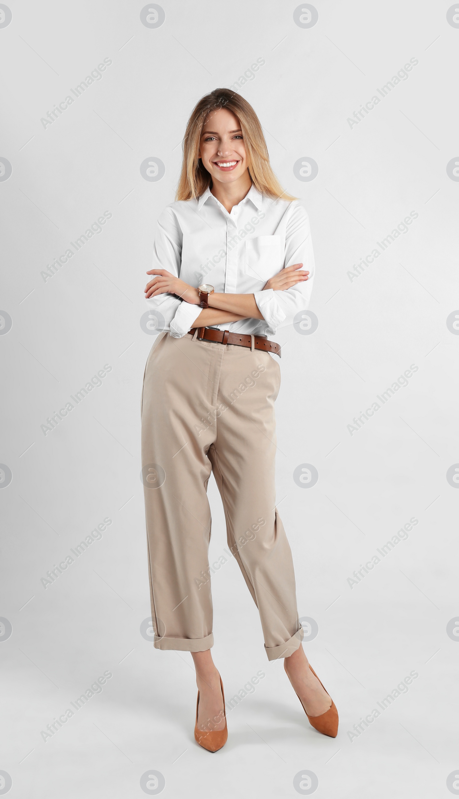 Photo of Full length portrait of beautiful young businesswoman on white background