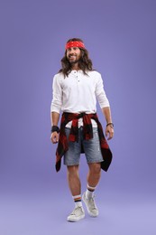 Photo of Stylish hippie man in white shirt on violet background