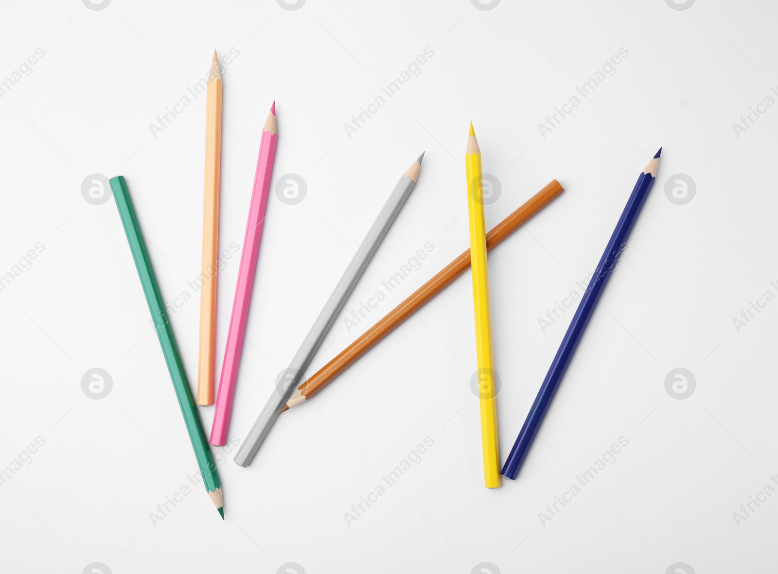 Photo of Colorful wooden pencils on white background, flat lay