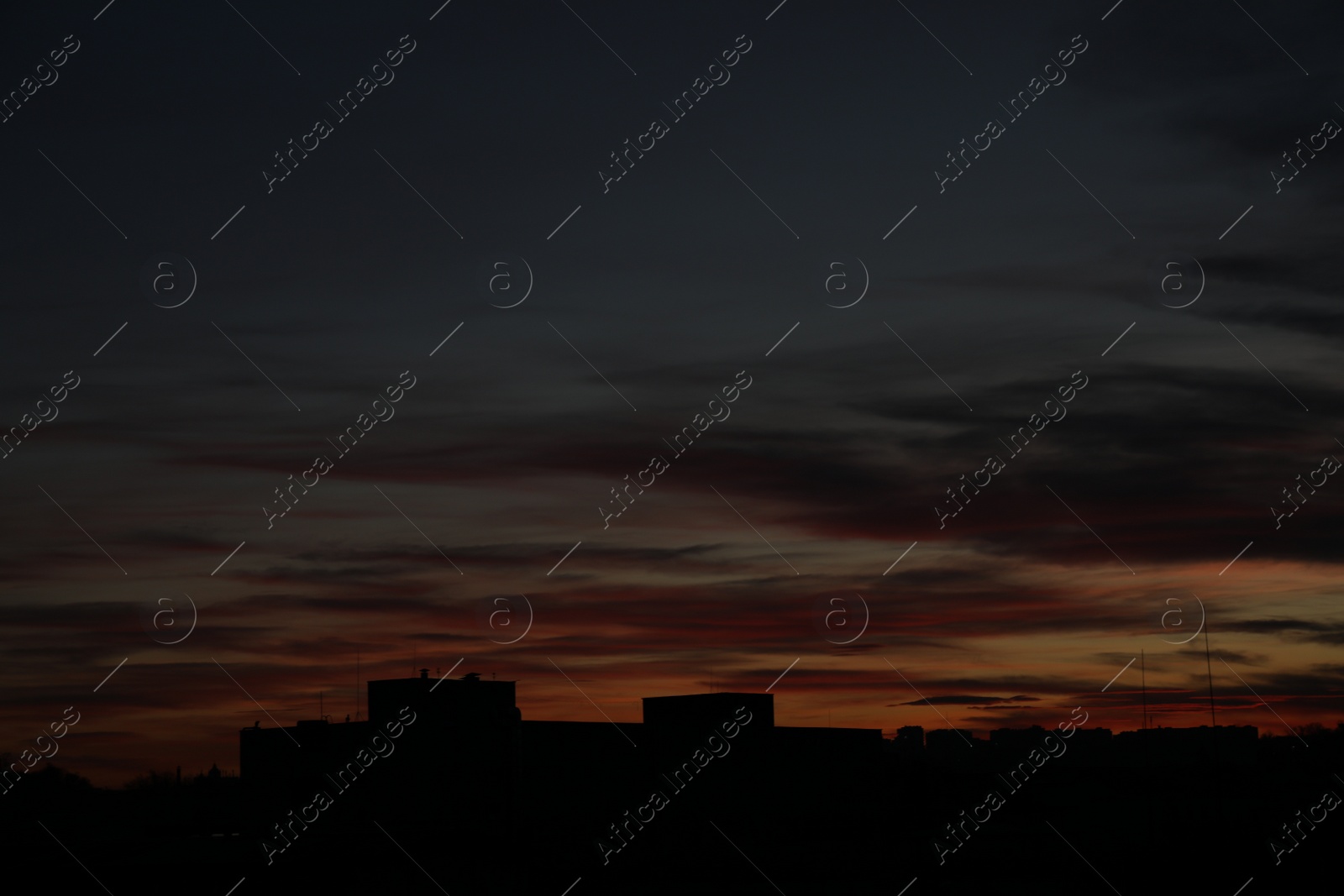 Photo of Beautiful sky with clouds over city in twilight