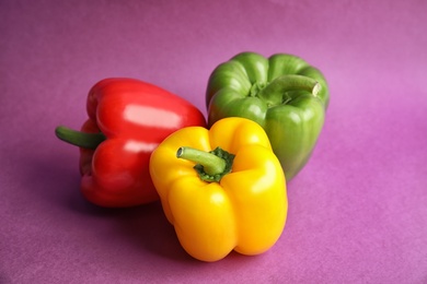 Photo of Raw ripe paprika peppers on color background