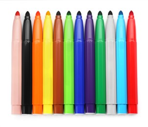 Many different colorful markers on white background, top view