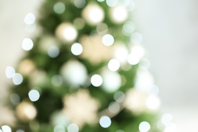 Photo of Blurred view of beautiful Christmas tree with lights