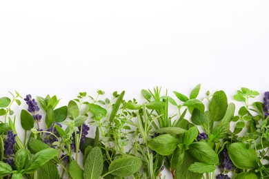 Photo of Many different aromatic herbs on white background, flat lay. Space for text