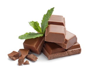 Photo of Pieces of milk chocolate with mint on white background