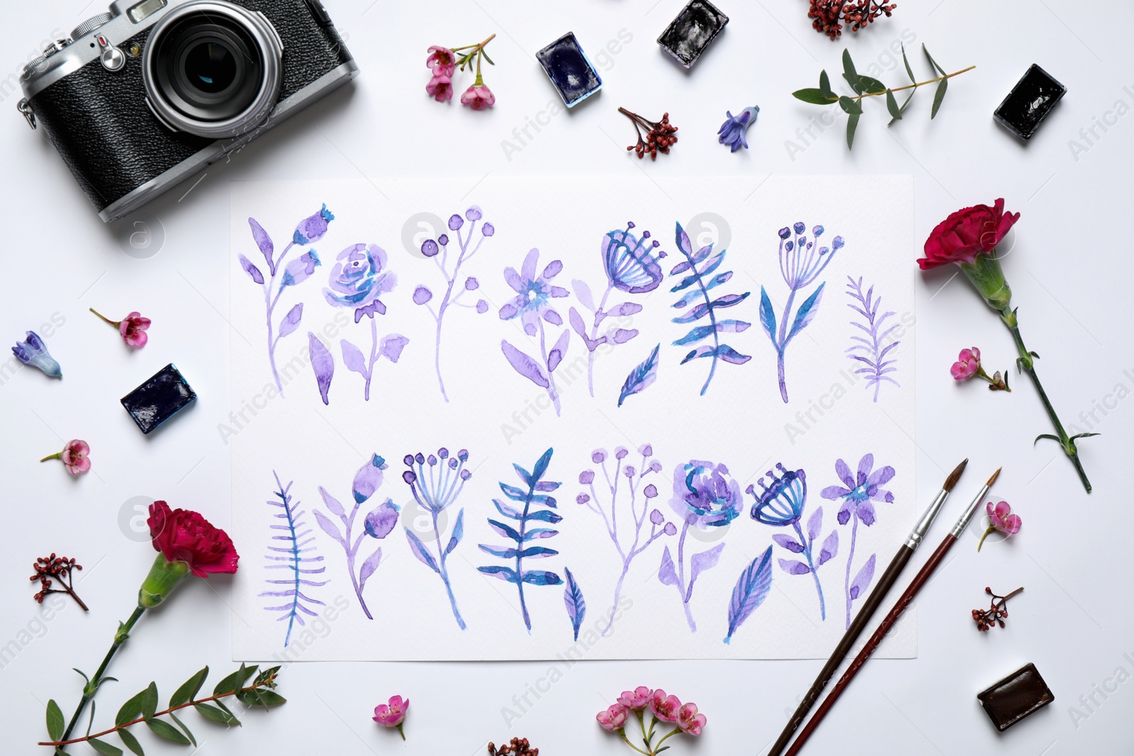 Photo of Flat lay composition with floral picture and watercolor paints on white background