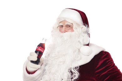 Photo of MYKOLAIV, UKRAINE - JANUARY 18, 2021: Santa Claus holding Coca-Cola bottle on white background